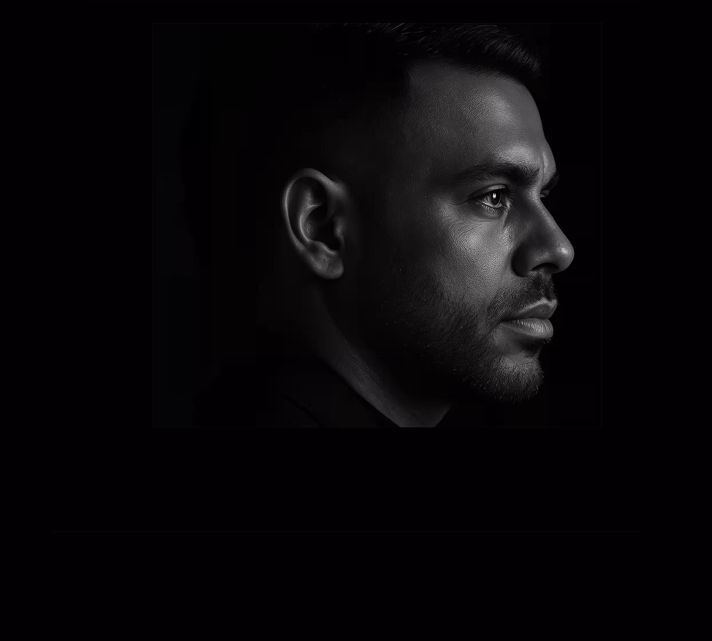 Black-and-white portrait of Sam Sharma